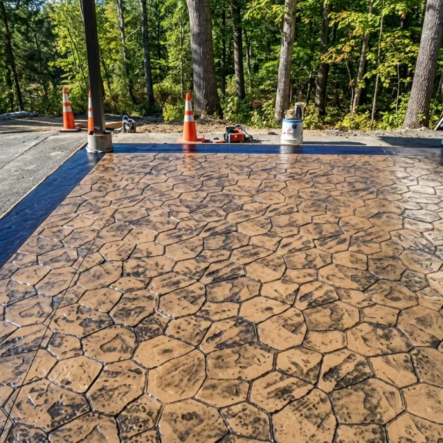 Warm-toned stamped concrete patio detail